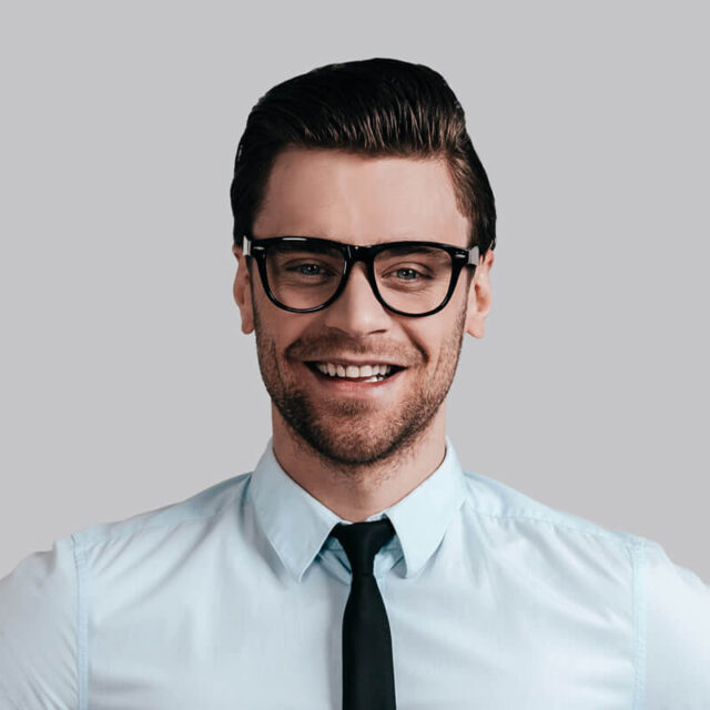 A man wearing glasses and a tie.